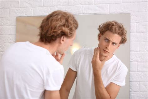 Young Man Looking In Mirror After Shaving Stock Image Image Of