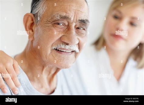 Nurse Caring For Senior Patient Stock Photo Alamy