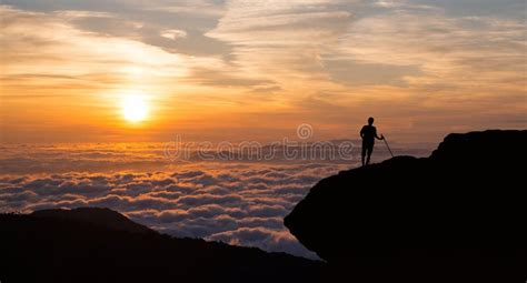 Man Standing On Cliff Above The Cloudy Valley Stock Image Image Of