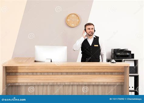 Portrait Of Receptionist Working At Desk Stock Photo Image Of Indoors