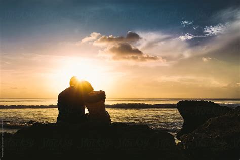 Young Couple At Sunset Beach By Stocksy Contributor Alexander Grabchilev Stocksy