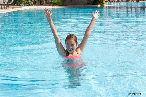 Young Teen Girl Swims And Have Fun In The Outdoor Stock Photo 1337170
