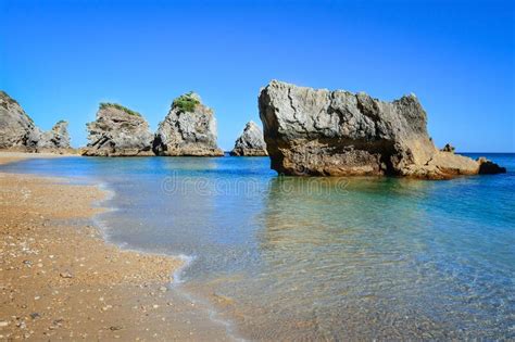 Quiet Clean Water Beach With Large Rocks Sesimbra Stock Photo Image