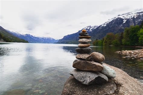 Free Photo Brown And Gray Stone Stack Near Body Of Water Boulders
