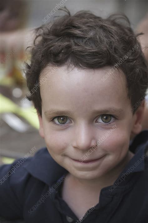 A Young Boy With Dark Hair And Brown Eyes Stock Image