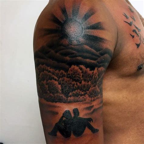 Mens Rising Sun Tattoo With Couple In Background On Arm Sun Tattoo