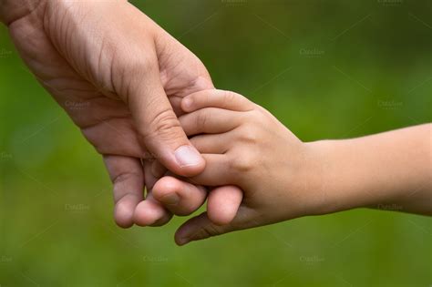 Adult Holding A Childs Hand ~ People Photos On Creative Market