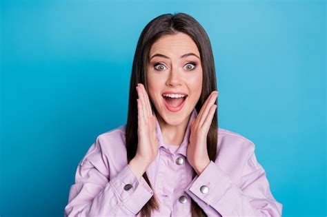 premium photo portrait of astonished crazy girl scream open mouth isolated over blue color