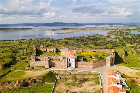 Mourao Drone Aerial View Of Castle With Alqueva Dam Lake Behind In