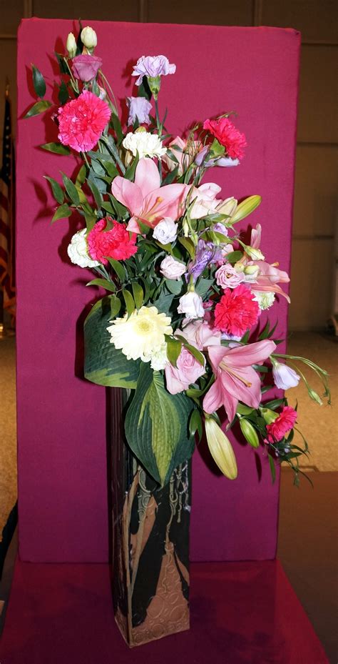 Line provides floral arrangement shape and structure. A creative line mass design by Julia A. Clevett at the ...