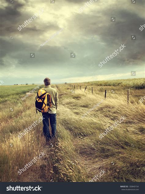 Man Walking Down Country Road On Stock Photo 130840154 Shutterstock