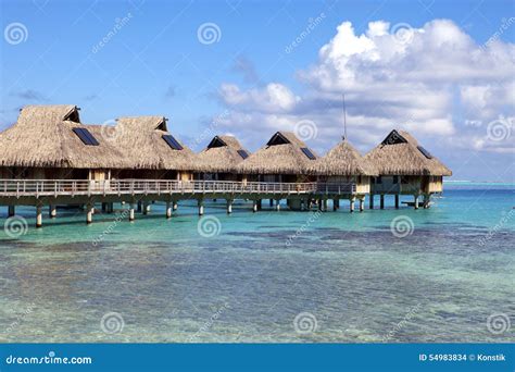 Typical Landscape Of Tropical Islands Huts Wooden Houses Over Water