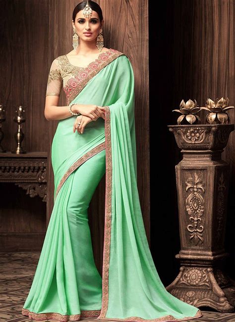 Mint Green And Beige Embroidered Silk Georgette Saree Features A