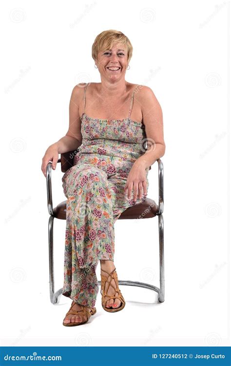 Full Portrait Of Middle Aged Woman Sitting On A Vintage Chair On Stock Photo Image Of Beauty