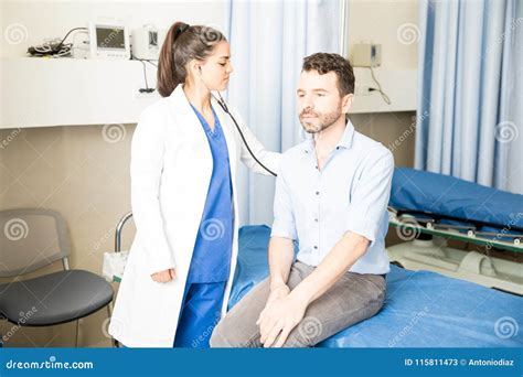 Doctor Examining Patient In Hospital Stock Image Image Of Visit