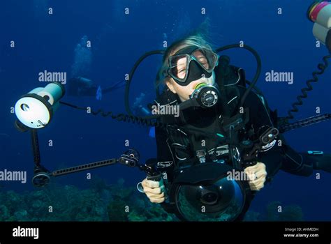 Underwater Scuba Diving Photographer Holding Camera In Housing Stock