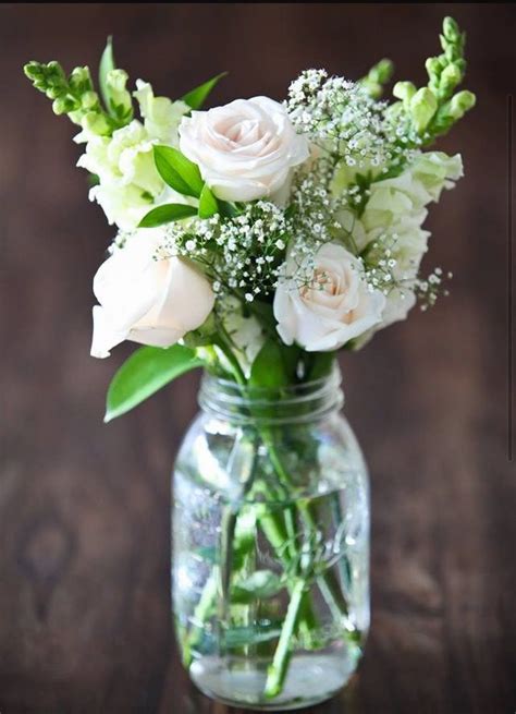 Mason Jars Filled With Fresh Flowers For Simple Centerpieces