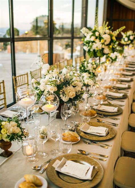 Elegant Banquet Tables Were Covered With Green And White Floral