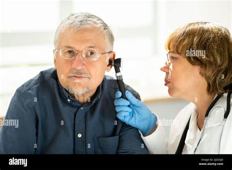 Otolaryngology Ear Check Using Otoscope Doctor Examining Patient Stock
