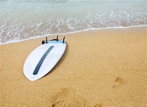 A Surfboard Is Lying On The Beach Next To It A Large Heart Is Drawn