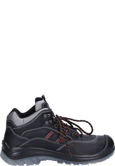 Once the shoe is complete, an inspector at the factory checks for defects such as poor lasting, incomplete cement bonding, and stitching errors. Canadian Line -Timo black- Work Shoes - a safety shoe to EN ISO 20345:2011 S3