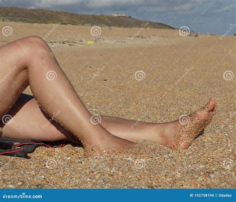 Women S Tanned Legs On The Sea Sand Stock Photo Image Of Recreational