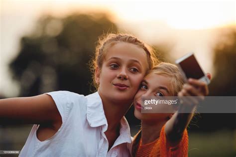 Closeup Of Girls Doing Selfie Outdoors High Res Stock Photo Getty Images