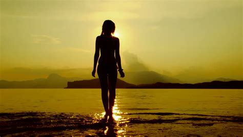 Silhouette Of A Woman Relaxing On The Beach Seaside Relaxation Stock