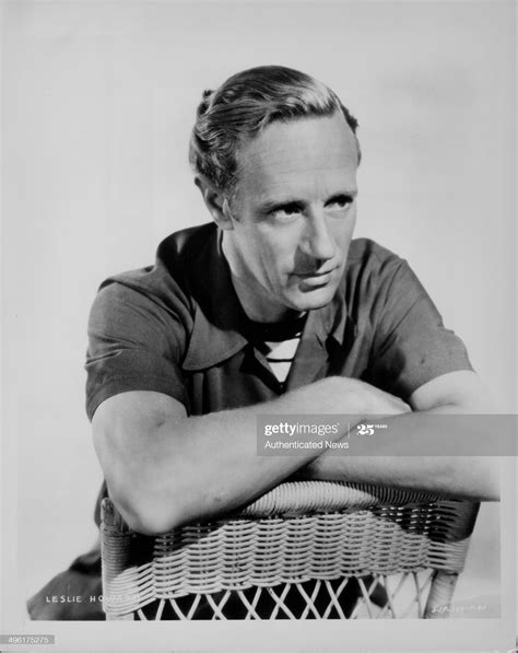 Posed Portrait Of Actor Leslie Howard Sitting In A Wicker Chair To