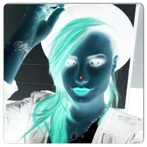 stare at the red dot on demi s nose for 30 seconds then blink really fast while looking at the