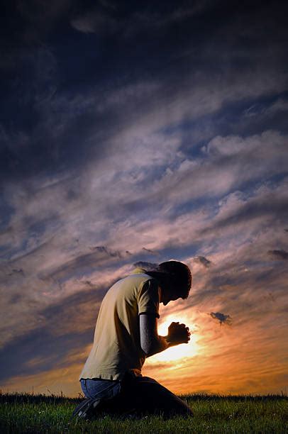 Man Praying On Knees Stock Photos Pictures And Royalty Free Images Istock
