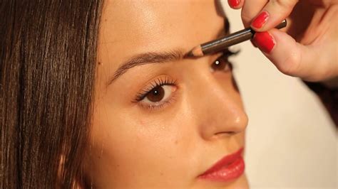 Makeup Artist Teaches Painting Eyebrows Stock Video Footage 0012 Sbv