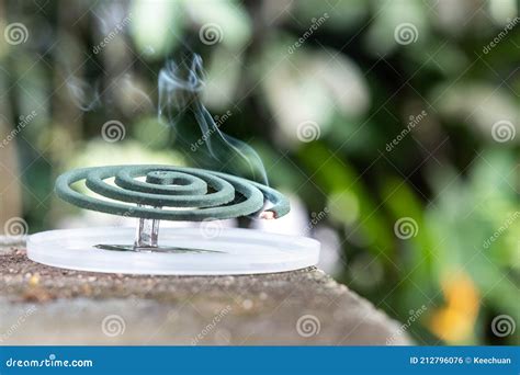 Closeup On Traditional Mosquito Repellent Coil Emit Smoke To Repel