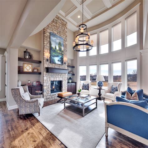 Great Room Floor To Ceiling Stone Fireplace Large Windows To Ceilings