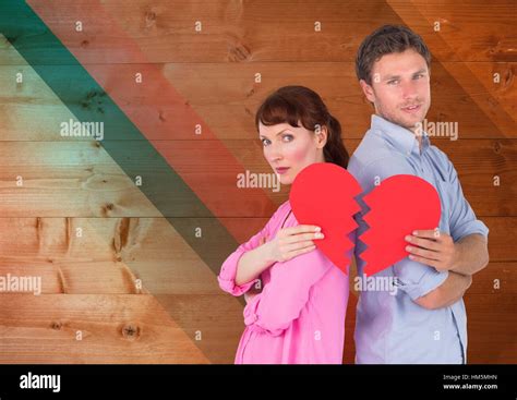 Depressed Couple Holding Broken Heart Stock Photo Alamy