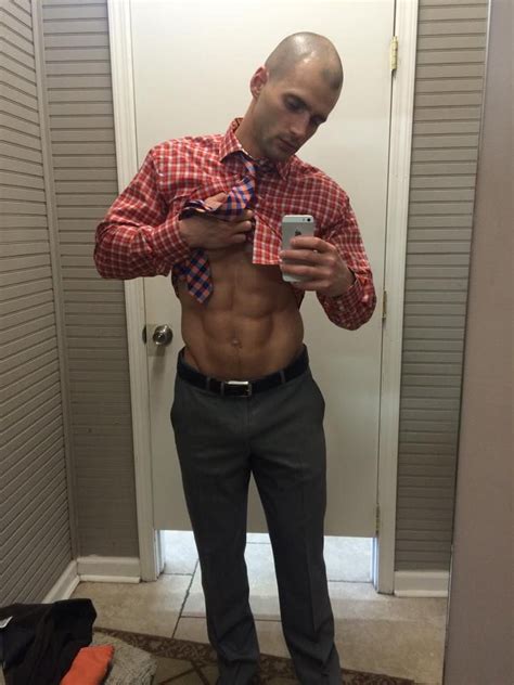 Todd Sanfield Lifts His Check Shirt Tie To Show His Pack One Of