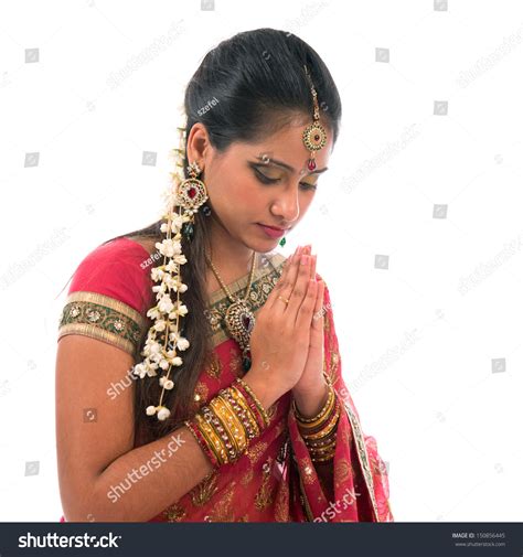 Portrait Of Beautiful Young Indian Woman Prayer In Traditional Sari