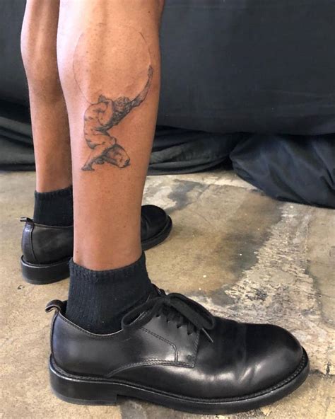 Atlas Tattooed On Lamar Johnsons Leg