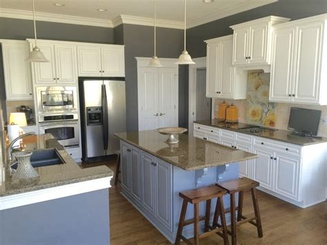 It is a light gray paint color and is more on the gray side. Sherwin Williams Extra White and Benjamin Moore Steel Wool - 2 Cabinet Girls