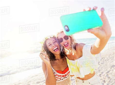Female Friends On Beach Stock Photo Dissolve