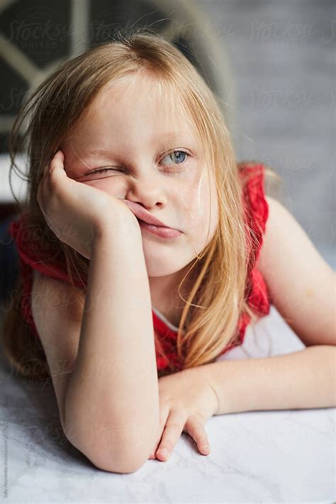 Child Leaning On Her Hand Looking Bored By Stocksy Contributor Sally
