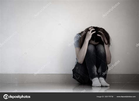 Sad Woman Hug Her Knee And Cry Sad Woman Sitting Alone In A Empty Room Stock Photo By