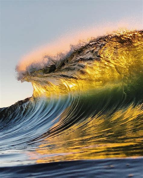 Photographer Captures Unbelievable Colors Reflected In Breaking Ocean