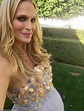 Molly Sims shows off her bump as she poses with her son in ball gown ...