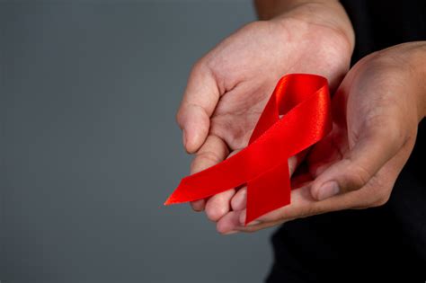 Free Photo Woman Hand Holding Red Ribbon Hiv Awareness Concept World