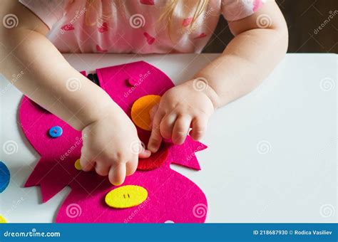 Little Toddler Girl Buttoning A Montessori Toy Stock Photo Image Of