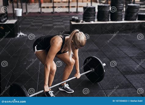 Young Woman Preparing To Lift Barbells In A Gym Stock Image Image Of Active Healthy 107204823