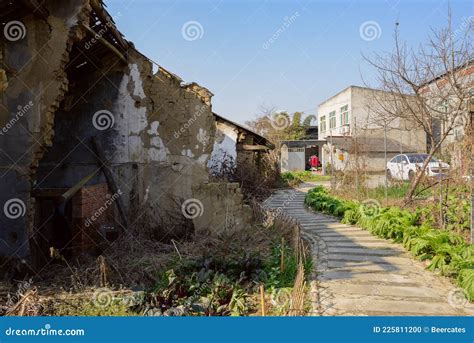 Ruined Ancient Farmhouse by Path in Vegetable Field Stock Photo - Image