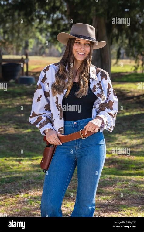 Lovely Brunette Cowgirl Enjoying A Day On Her Farm Before Riding Her