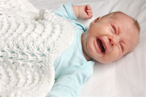 Sweet Newborn Baby Crying In Crib Stock Photo By ©christinlola 70408923